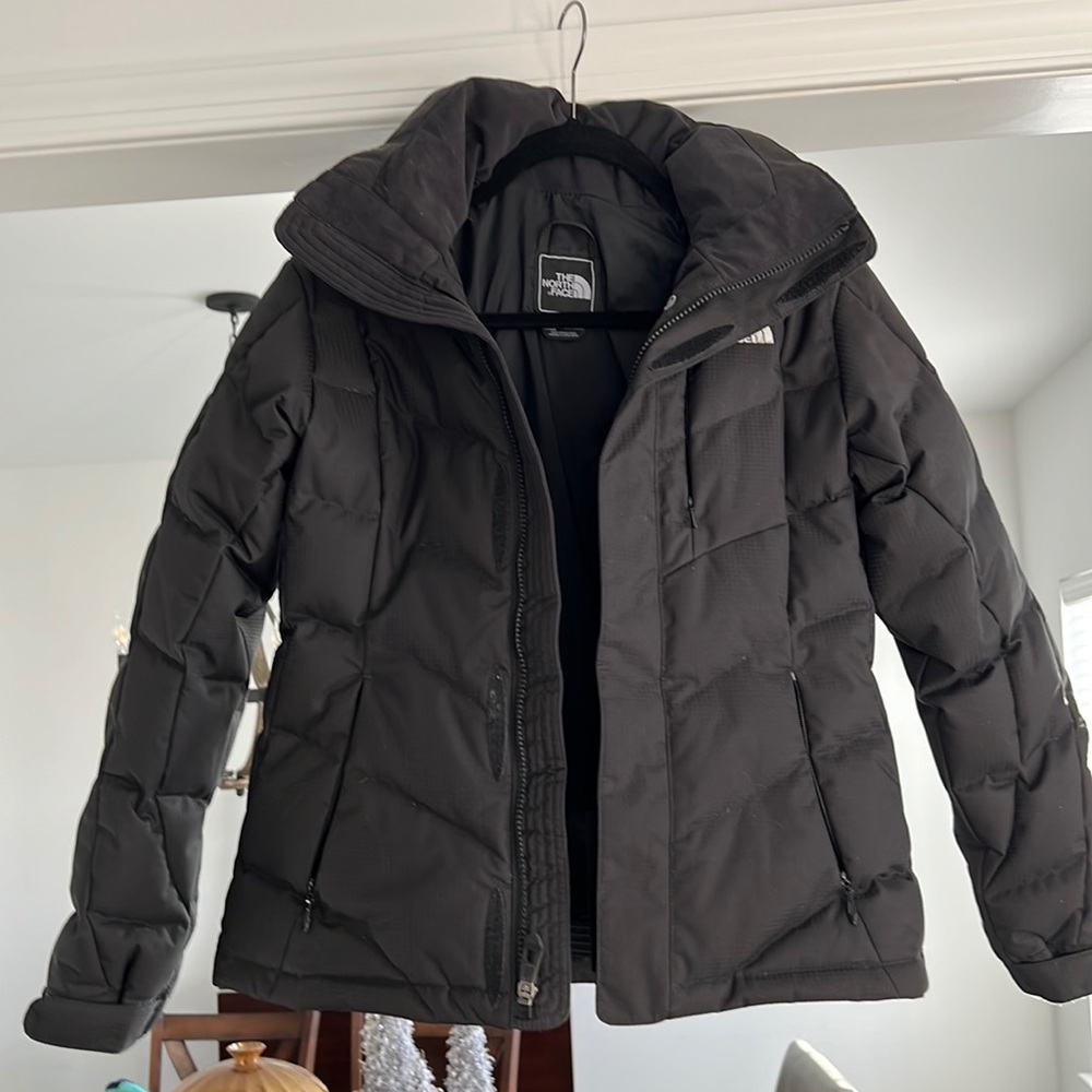 Womens black North Face jacket in size small.